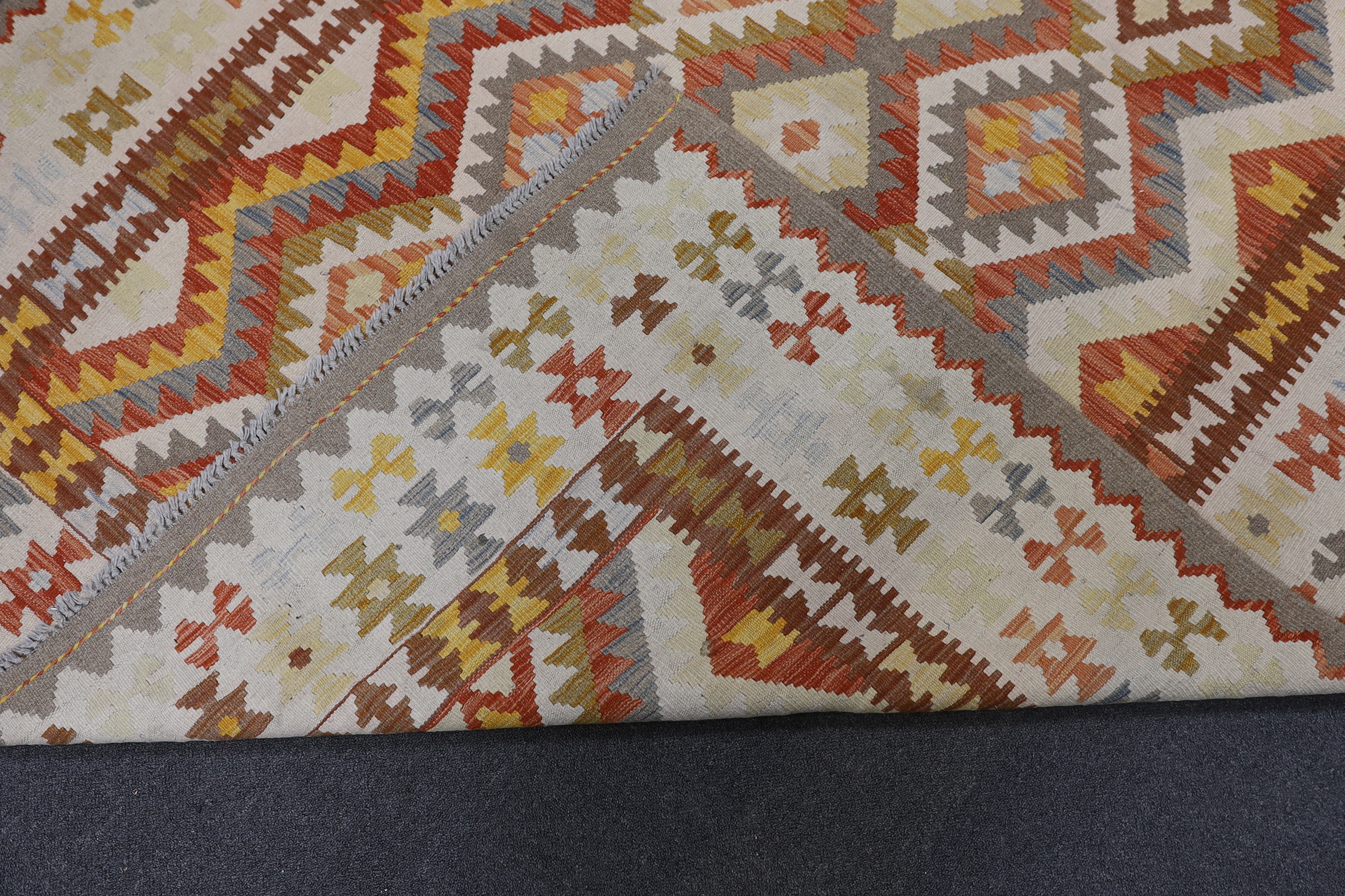 A Kilim polychrome geometric carpet, 250 x 177cm